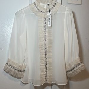 Never worn alice and Olivia top